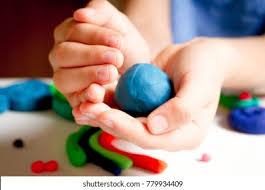 hands holding a ball of clay